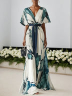 Vestido longo azul com estampa, chiffon, decote em V, mangas curtas e modelo evasê