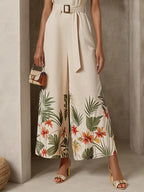 Damen cremeweißes, florales Jumpsuit mit Ausschnitten, Rundhalsausschnitt, ärmellos, Urlaub