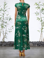 Grünes Blumen A-Linien Maxikleid mit kurzen Ärmeln und Schlitz