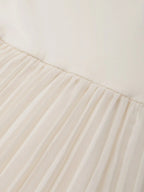 Beiges, plissiertes Strickkleid mit Rundhalsausschnitt, ärmellos, A-Linie, Midi-Jerseykleid