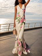 Vestido rosa com estampa floral, decote em V cruzado, sem mangas, estilo sereia