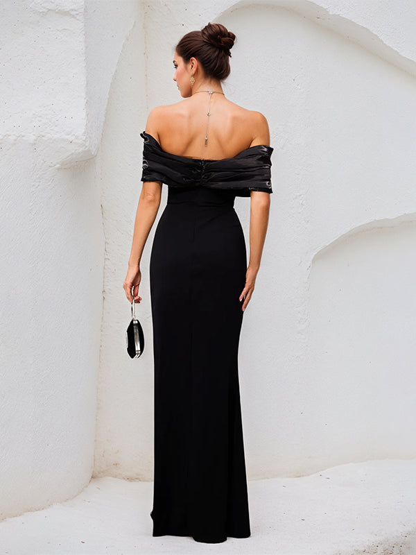 Vestido largo negro de crepé elástico sin tirantes y escote off-shoulder con abertura alta