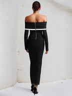 Vestido negro de crepé elástico con mangas largas y escote off the shoulder hasta el tobillo
