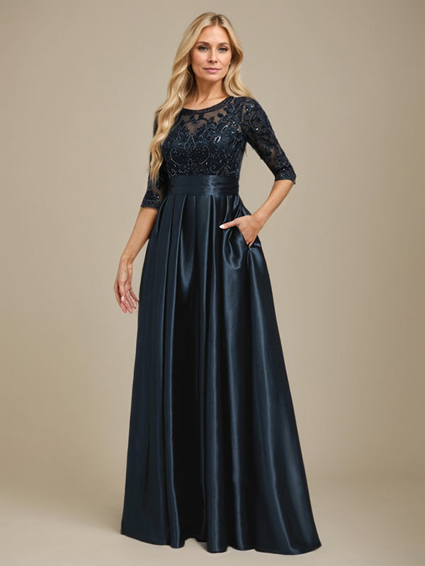 Vestido de mãe da noiva em cetim stretch com renda, comprimento até o chão, corte evasê, decote redondo com ilusão e laço com paetês