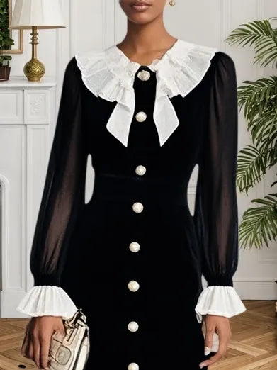 Vestido midi de terciopelo negro con volantes y abertura, estilo sirena