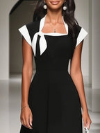 Vestido midi clássico preto com decote quadrado, manga curta com laço e evasê