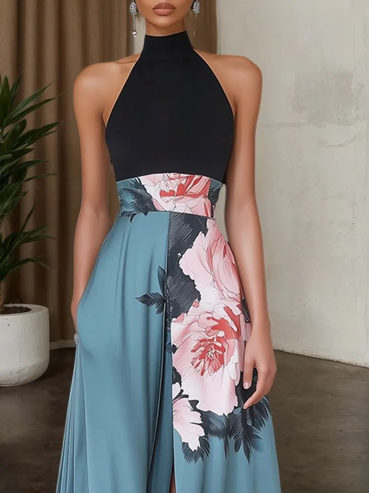 Vestido maxi línea A negro de satén con tirantes halter, sin mangas y abertura con estampado floral