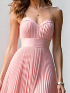 Vestido largo de dama de honor línea A de gasa rosa con escote corazón y sin mangas plisado
