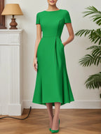 Vestido de festa coquetel verde evasê com bolsos midi