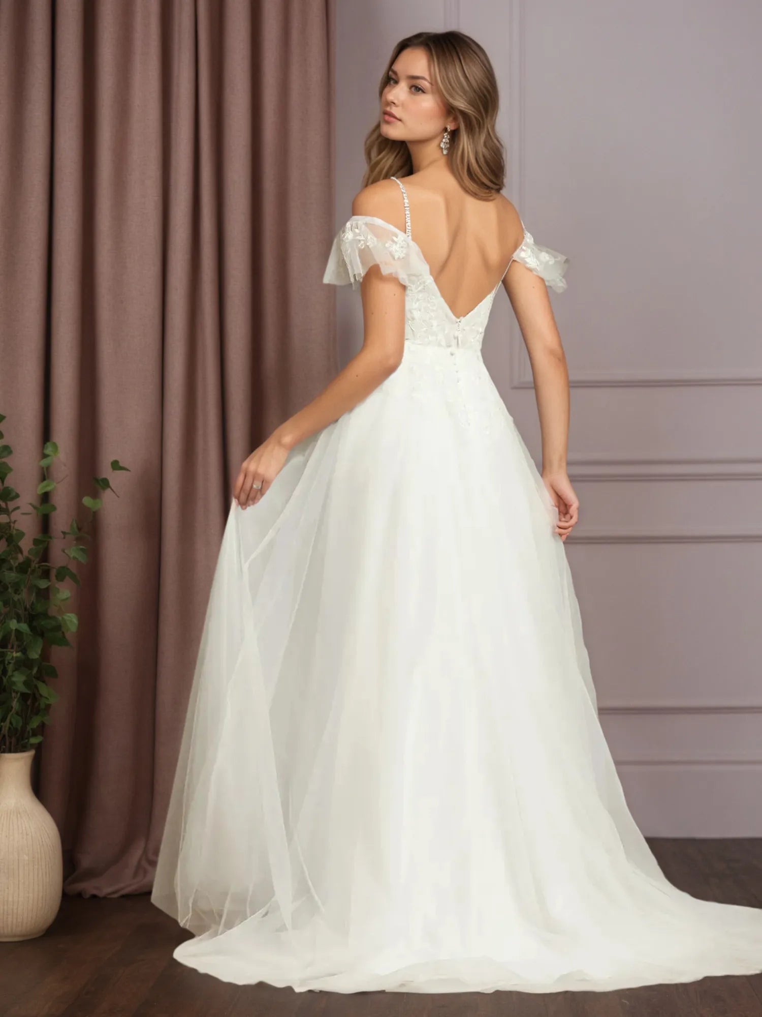 Abito da sposa bianco in tulle a linea A con scollo a V, senza maniche e decorato con paillettes