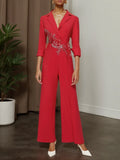 Mono de pierna ancha con blazer de solapa y aplicaciones florales rojas