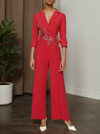 Mono de pierna ancha con blazer de solapa y aplicaciones florales rojas