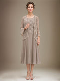 Vestido de mãe da noiva evasê, comprimento tea-length, em renda e chiffon com decote redondo e lantejoulas