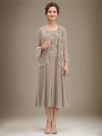 Vestido de mãe da noiva evasê, comprimento tea-length, em renda e chiffon com decote redondo e lantejoulas