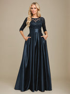 Vestido de mãe da noiva em cetim stretch com renda, comprimento até o chão, corte evasê, decote redondo com ilusão e laço com paetês