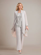 Elegante tuta argento in chiffon senza maniche con applicazioni per madre della sposa e scollo a incrocio