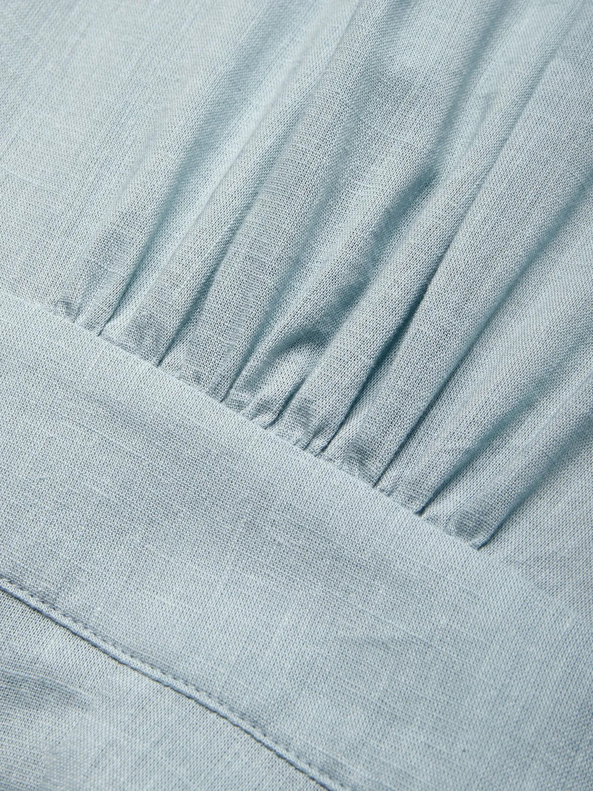 Abito lungo azzurro chiaro in lyocell lino con scollo a V, spalline sottili e cintura a fiocco