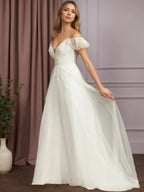 Abito da sposa bianco in tulle a linea A con scollo a V, senza maniche e decorato con paillettes