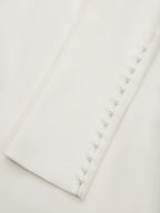 Vestido midi blanco ajustado con mangas largas y lazo