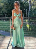Abito lungo da ballo sexy color acqua con fiocco frontale e cut-out
