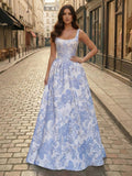 Abito lungo da ballo con corsetto in broccato blu con fiori e perle