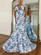 Abito da sera sirena blu con stampa floreale, scollo a V e spalline con fiocco da annodare