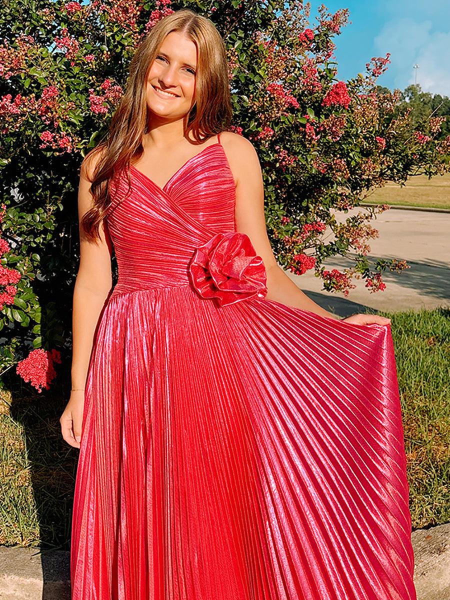 Robe de bal longue plissée métallisée fuchsia avec rosette