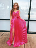 Robe de bal longue plissée métallisée fuchsia avec rosette