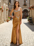 Abito da ballo con corsetto in satin trasparente e strass dorati con spacco