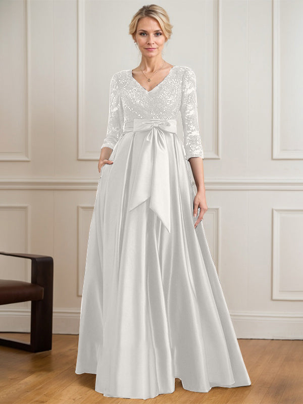 Robe mère de la mariée en satin et dentelle, coupe trapèze, col en V, longue avec nœud à sequins