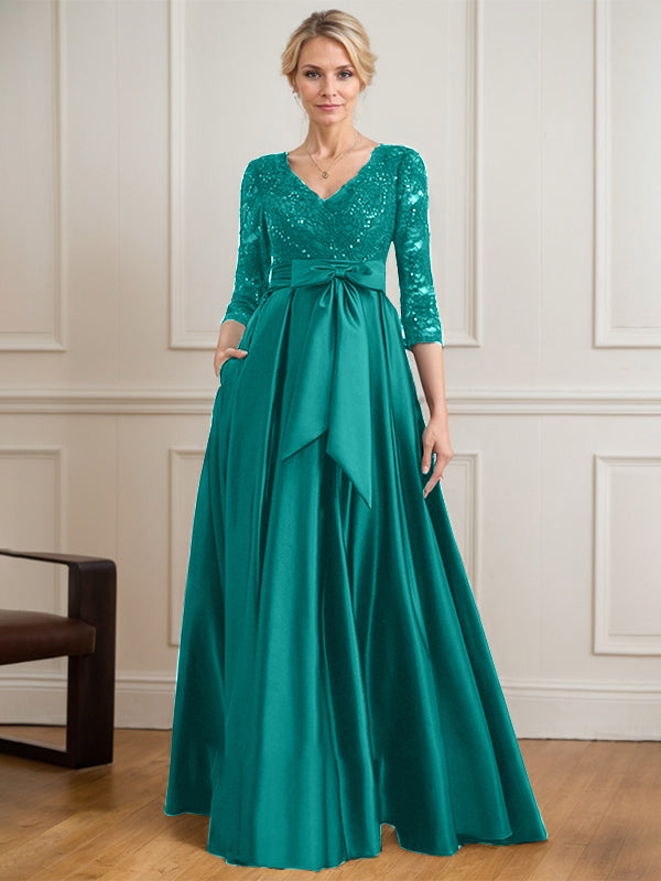Robe mère de la mariée en satin et dentelle, coupe trapèze, col en V, longue avec nœud à sequins