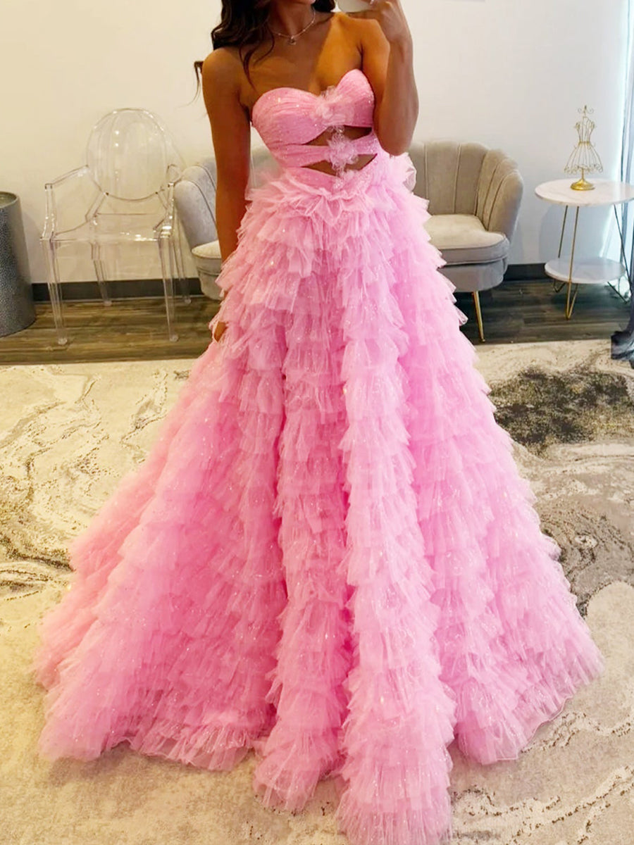 Abito da ballo rosa in tulle glitterato con balze e dettagli cutout