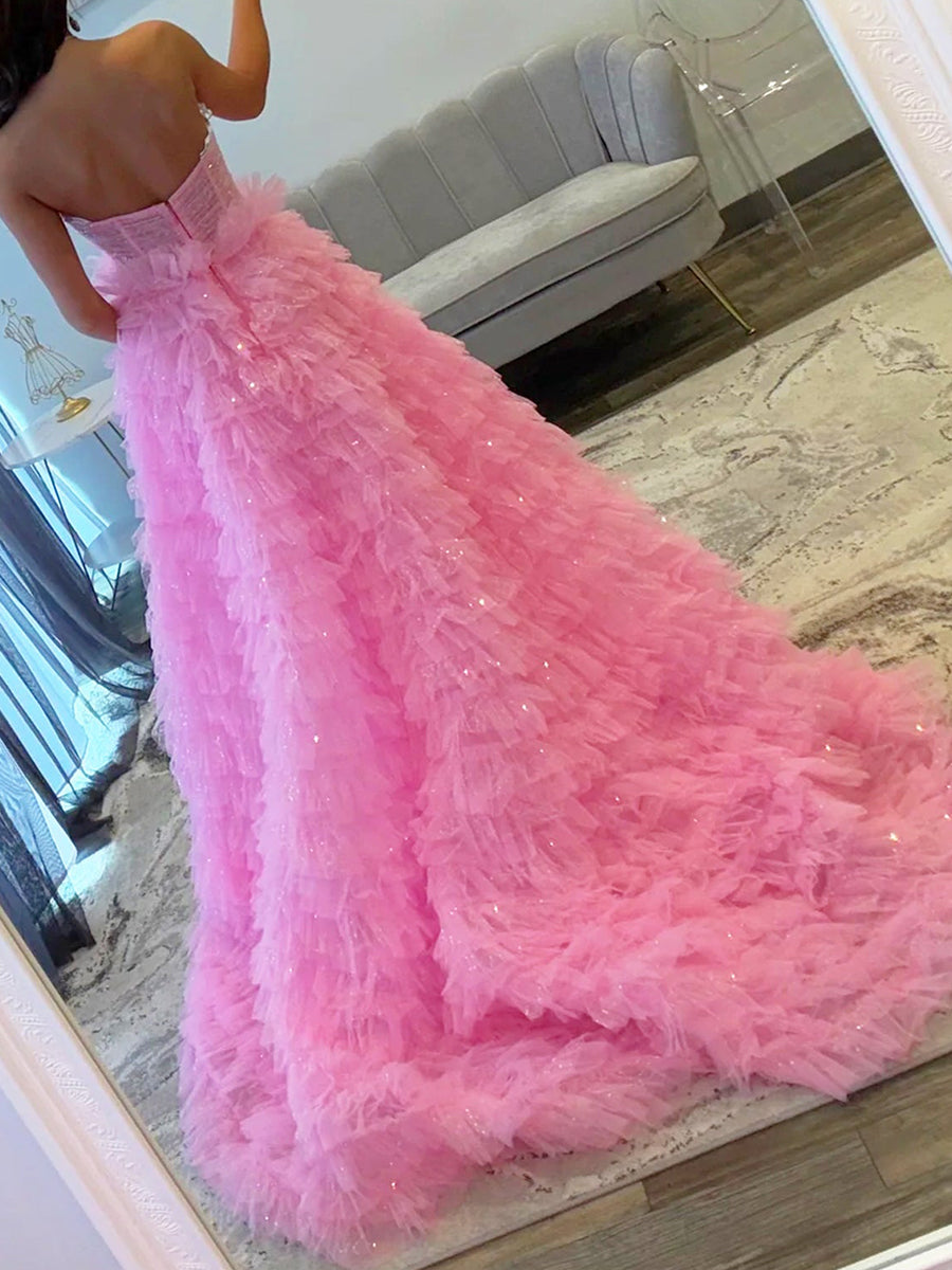 Abito da ballo rosa in tulle glitterato con balze e dettagli cutout