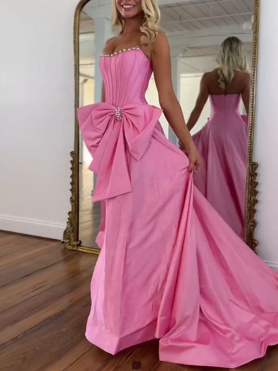 Vestido de fiesta rosa de satén sin tirantes con corsé, escote con perlas y lazo