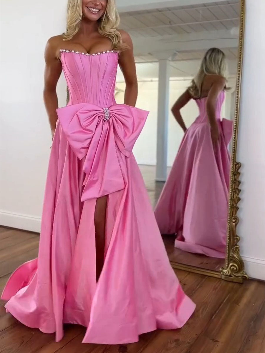 Vestido de fiesta rosa de satén sin tirantes con corsé, escote con perlas y lazo