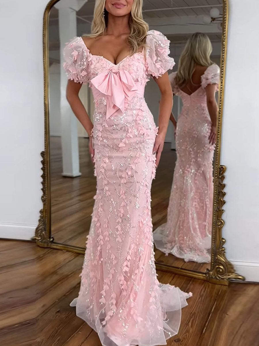 Vestido largo de fiesta sirena con lentejuelas rosas y detalle de lazo en forma de hoja