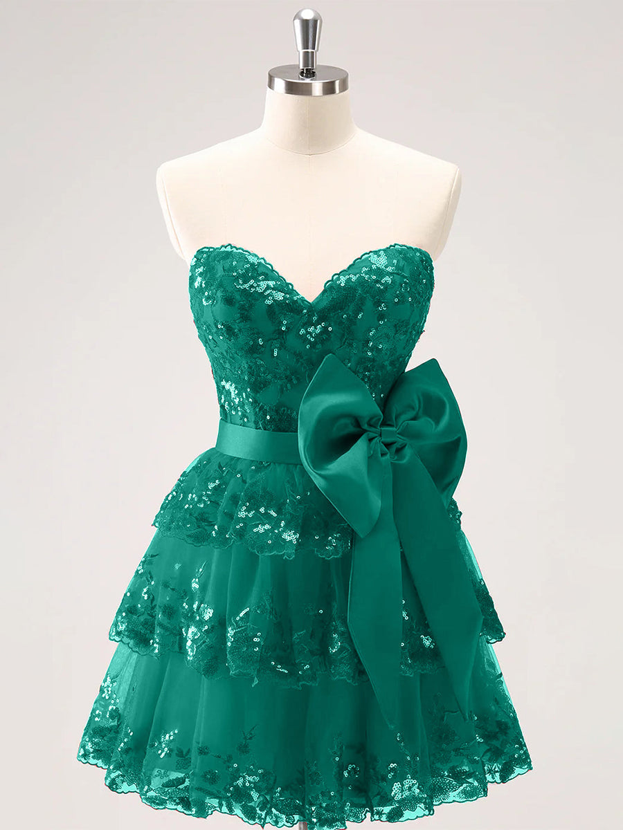 Vestido de formatura brilhante em corte A com corpete de decote coração, babados em camadas e laços