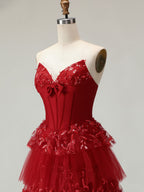 Robe de bal longue à volants avec corset et appliques florales 3D