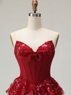 Robe de bal longue à volants avec corset et appliques florales 3D