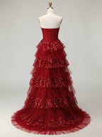 Robe de bal longue à volants avec corset et appliques florales 3D