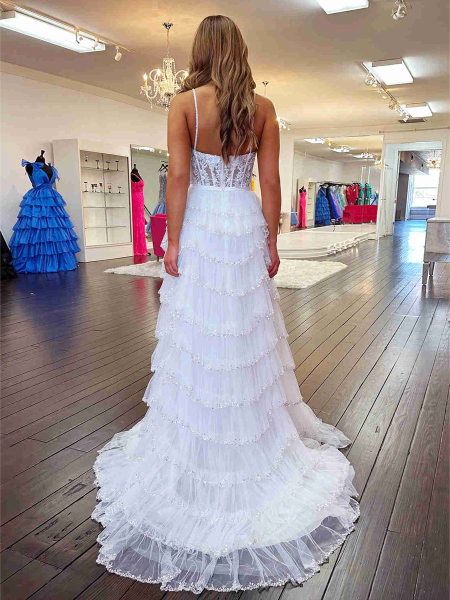 Abito lungo da ballo con spalline, paillettes floreali e balze multiple con spacco
